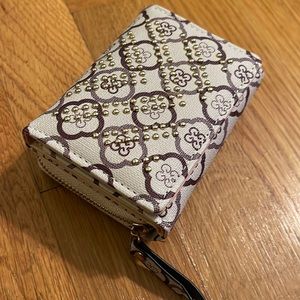 Wallet tan/crème with gold embroidery. Never used! Has lots of compartments!